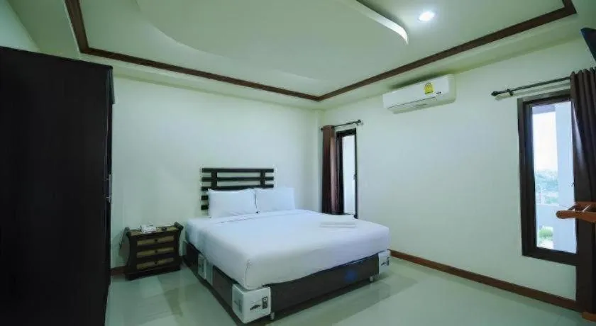 Bed in AmornSukhothai Hotel