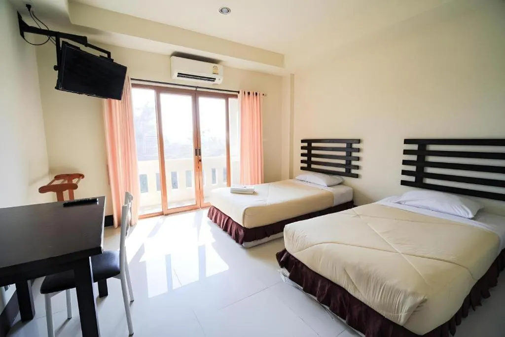 Bed in AmornSukhothai Hotel