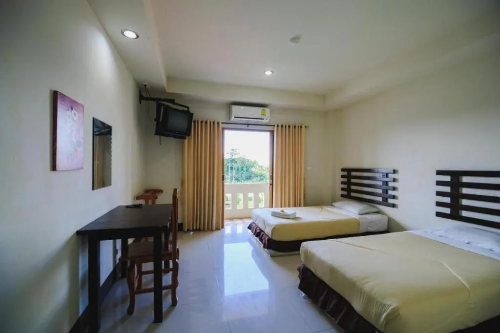 Bed in AmornSukhothai Hotel