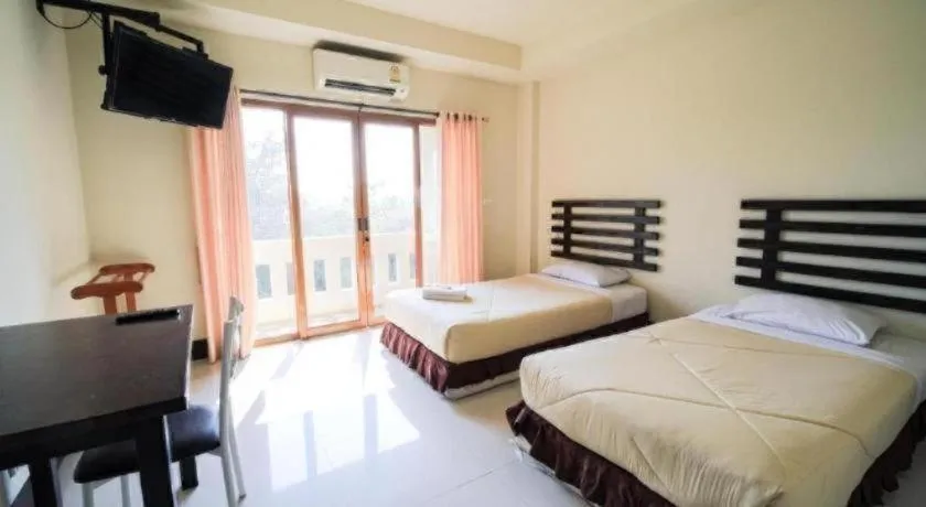 Bed in AmornSukhothai Hotel