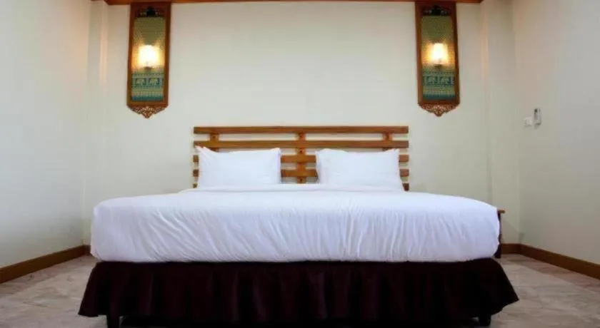 Bed in AmornSukhothai Hotel