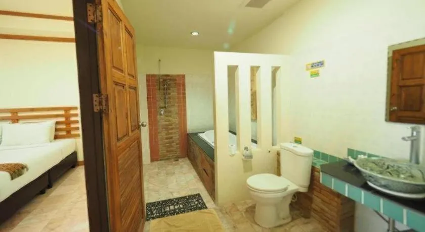 Bed in AmornSukhothai Hotel