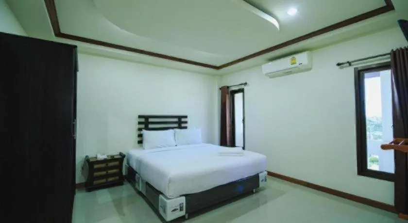 Bed in AmornSukhothai Hotel