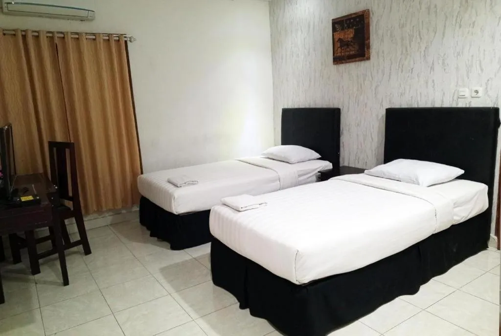 Bed in The Garden Hotel