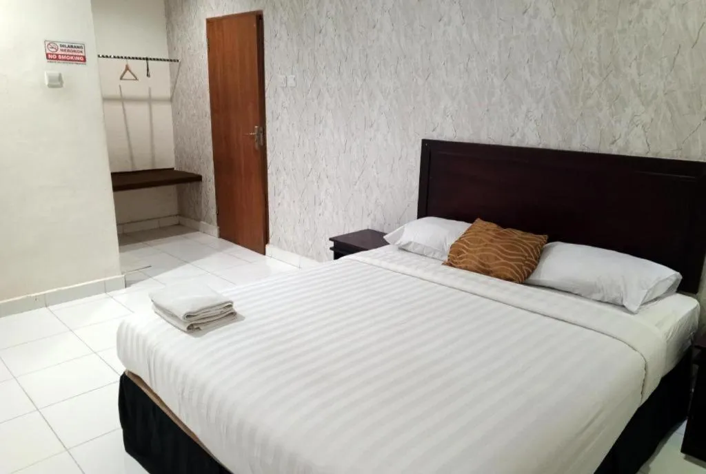 Bed in The Garden Hotel