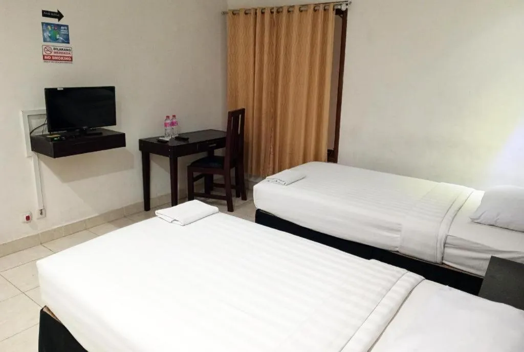 Bed in The Garden Hotel