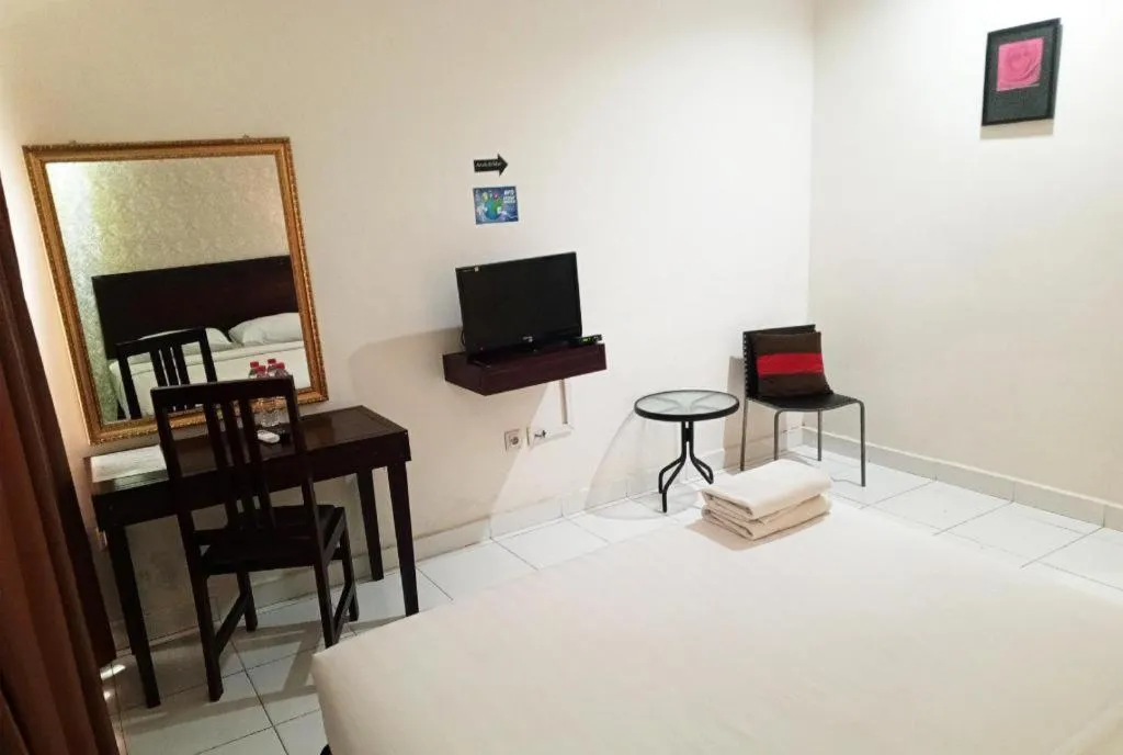 Bed in The Garden Hotel