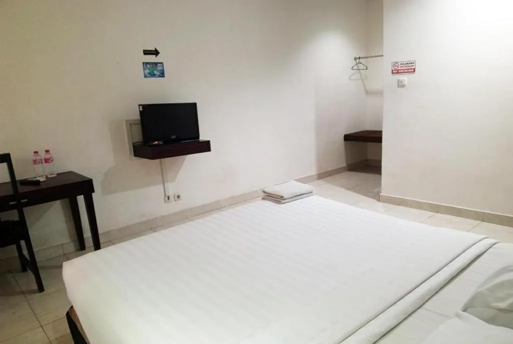 Bed in The Garden Hotel