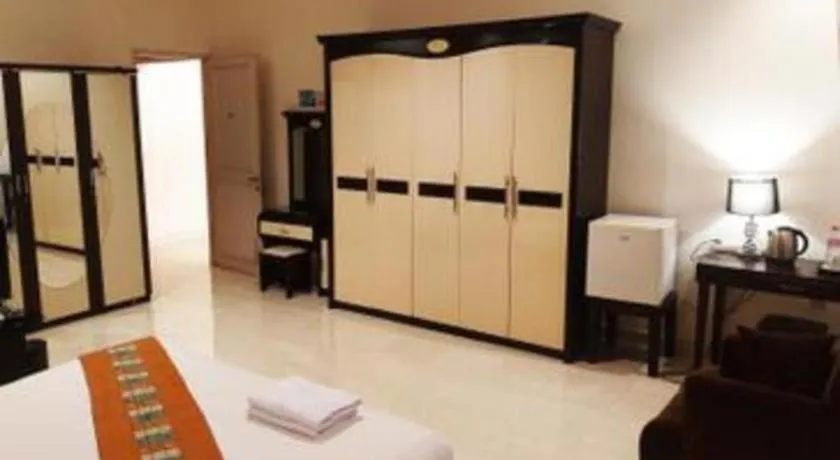 Bed in The Garden Hotel