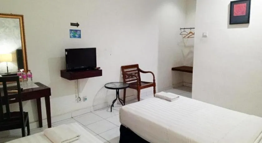 Bed in The Garden Hotel