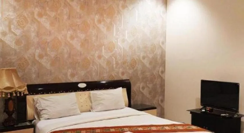 Bed in The Garden Hotel