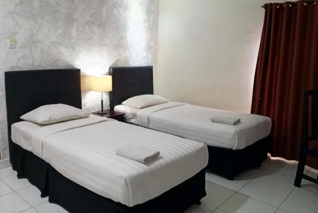 Bed in The Garden Hotel