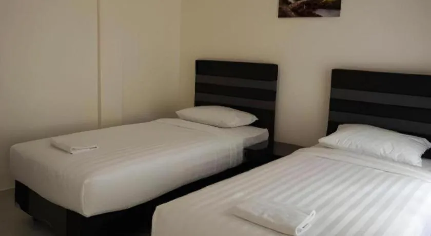 Bed in The Garden Hotel