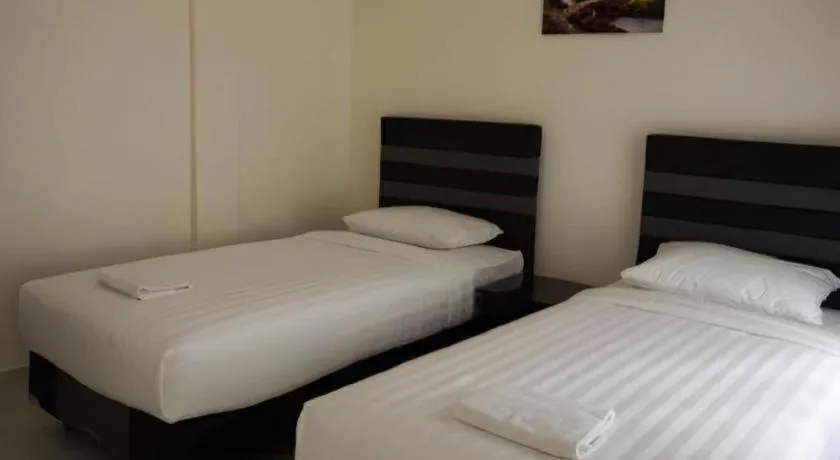 Bed in The Garden Hotel