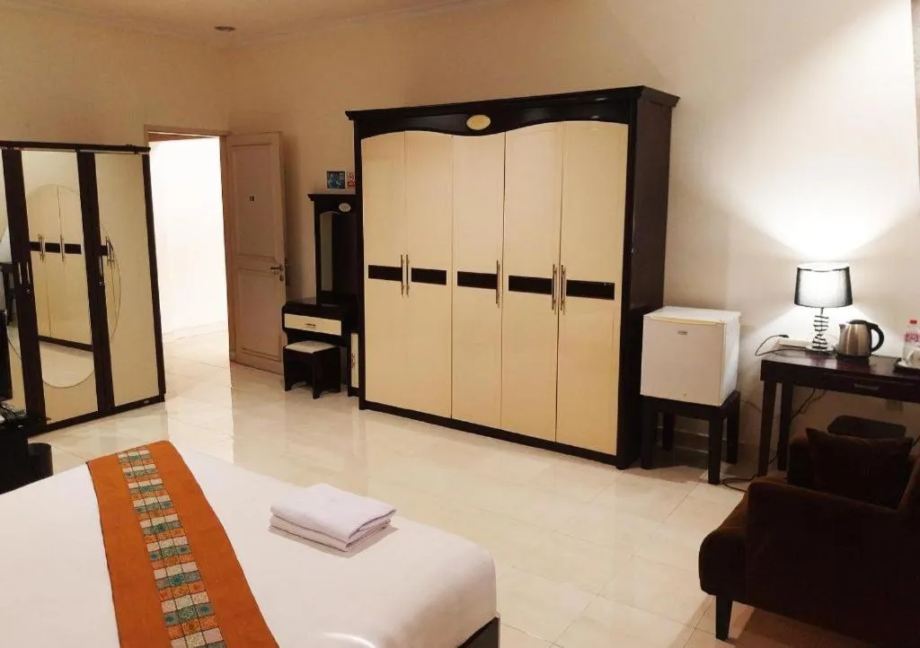 Bed in The Garden Hotel