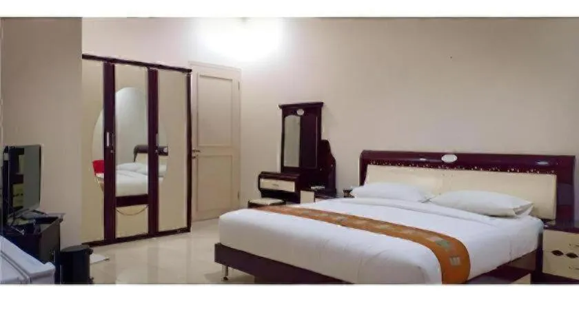 Bed in The Garden Hotel