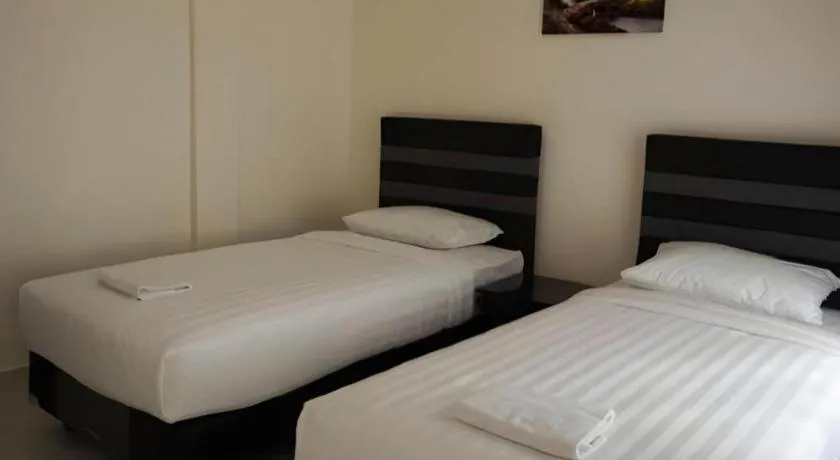 Bed in The Garden Hotel