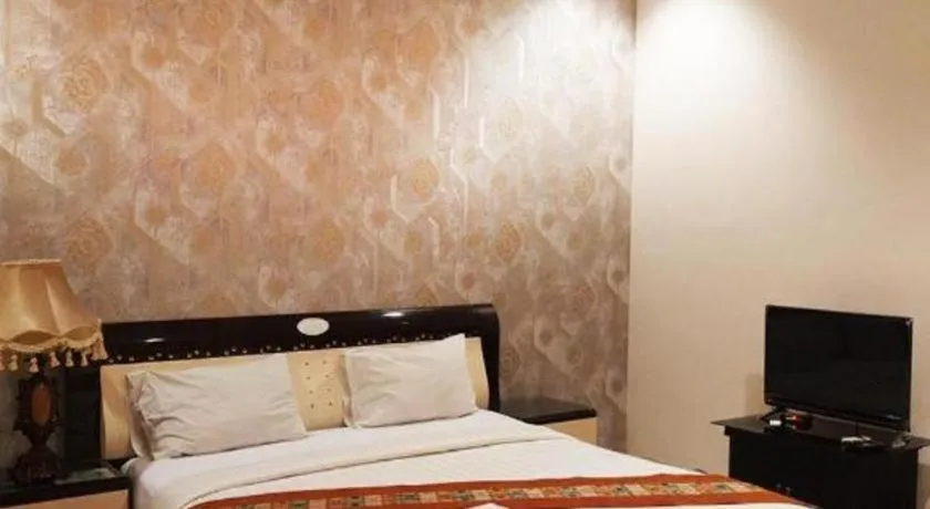 Bed in The Garden Hotel