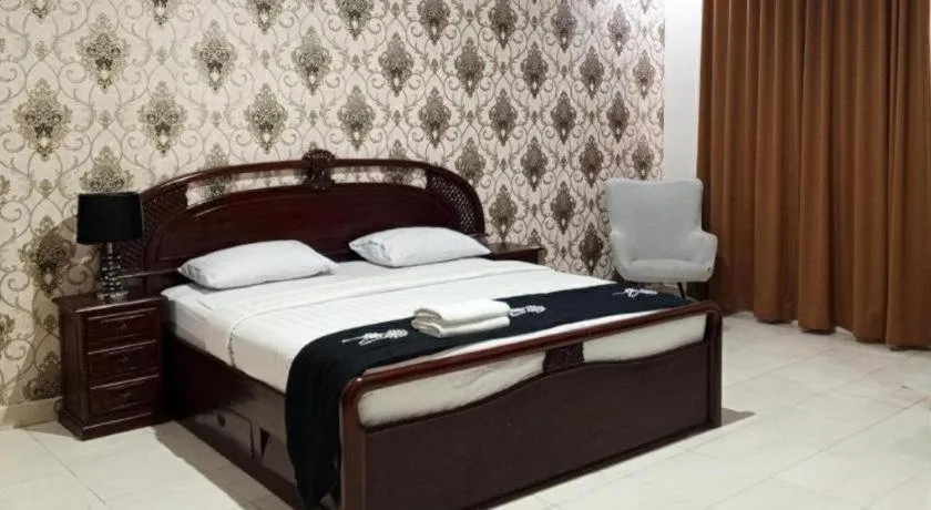 Bed in The Garden Hotel