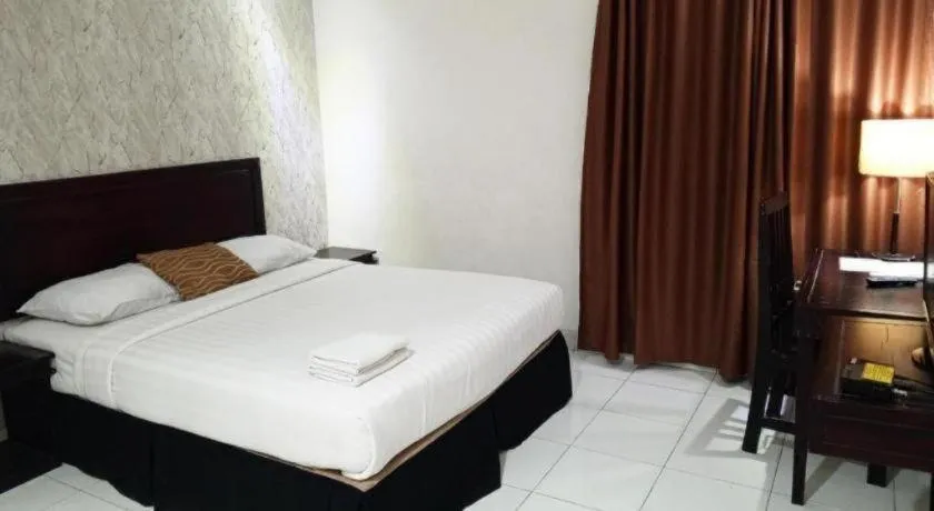 Bed in The Garden Hotel