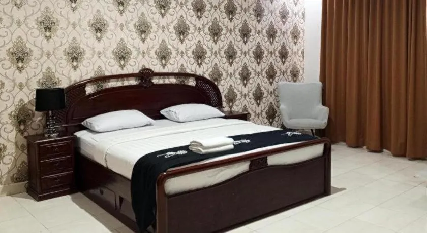 Bed in The Garden Hotel