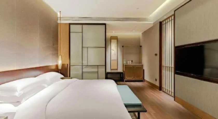 Bed in Wuxi Shanse Hotel