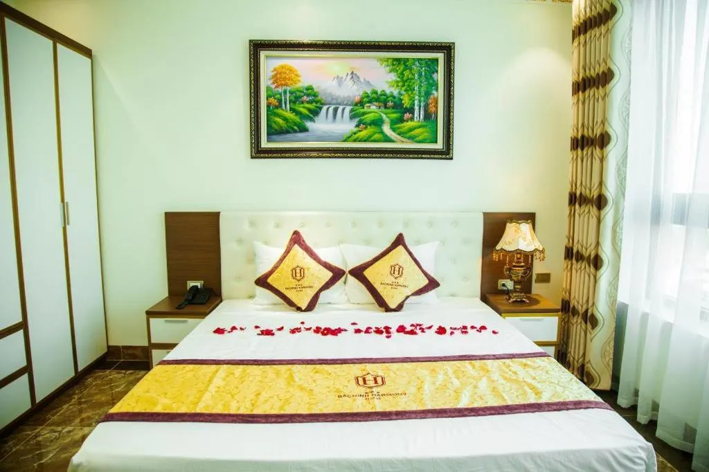 Bed in BACNINH HARMONY HOTEL