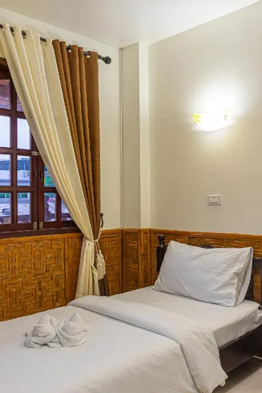 Bed in Coucou Bar Hotel and Restaurant