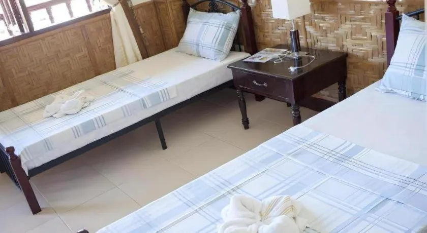 Bed in Coucou Bar Hotel and Restaurant