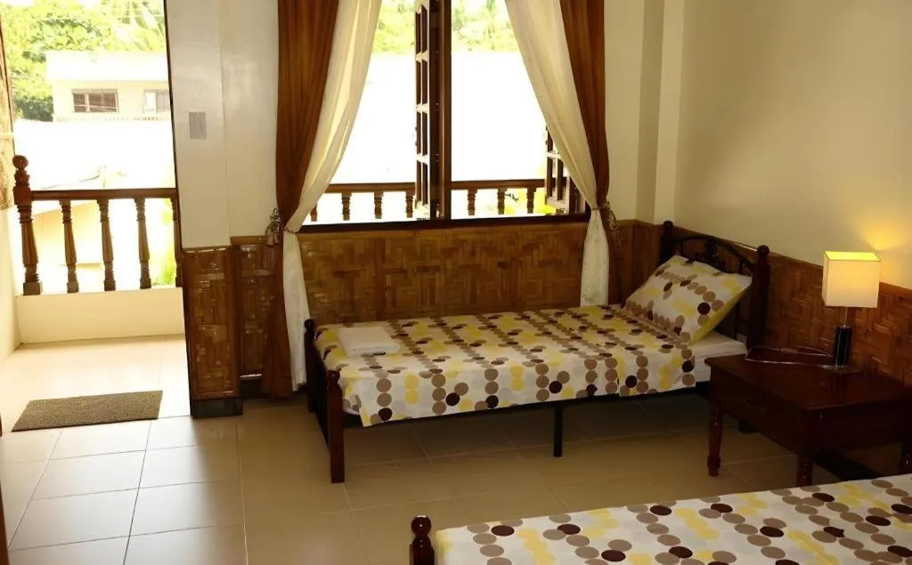 Bed in Coucou Bar Hotel and Restaurant