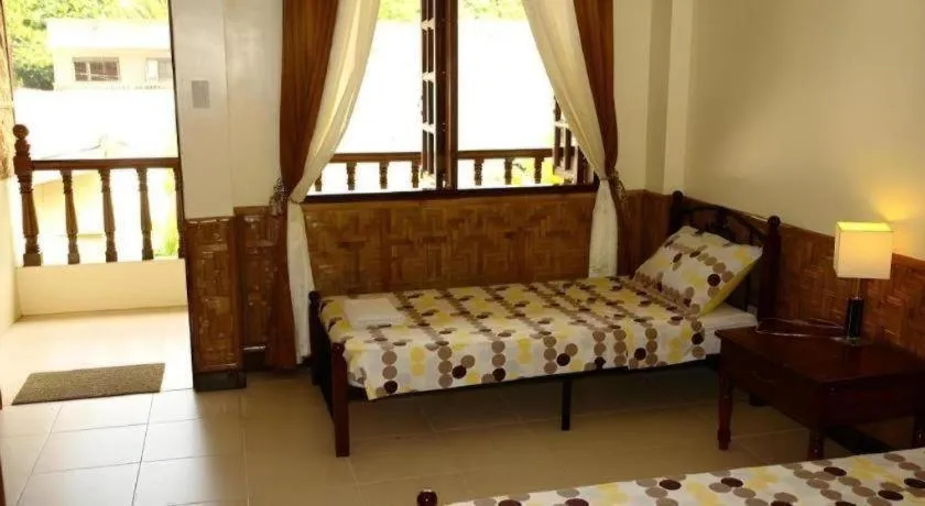 Bed in Coucou Bar Hotel and Restaurant