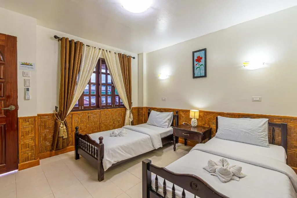 Bed in Coucou Bar Hotel and Restaurant