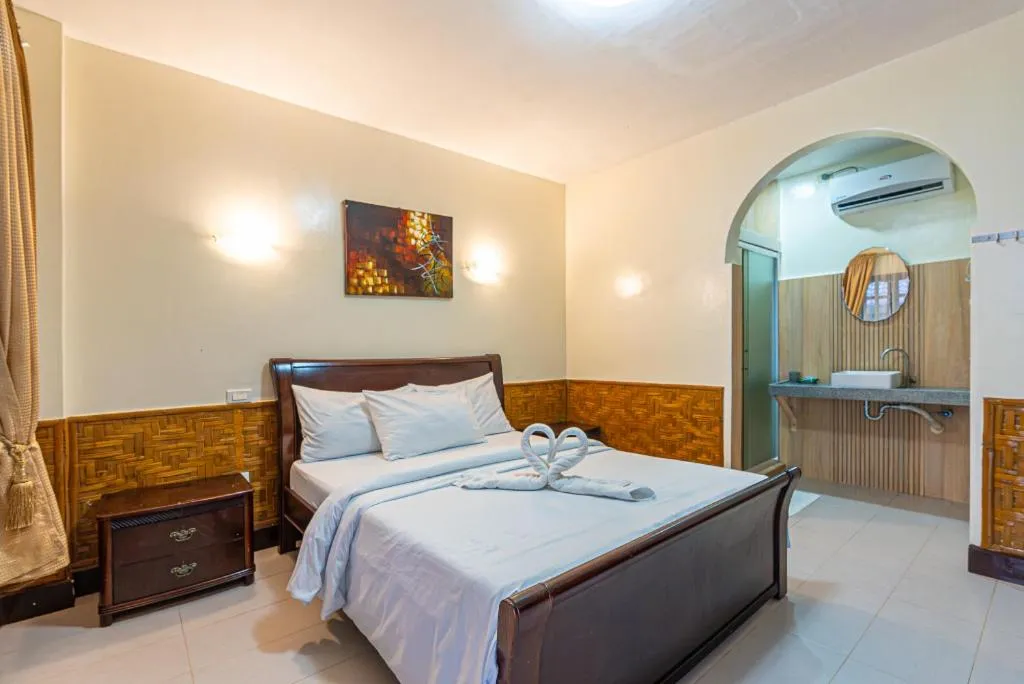 Bed in Coucou Bar Hotel and Restaurant