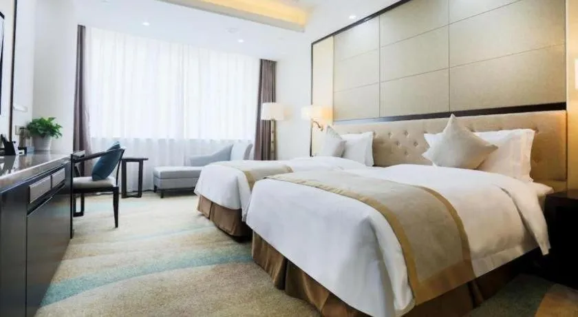 Bed in Hundred Hotel Qingdao