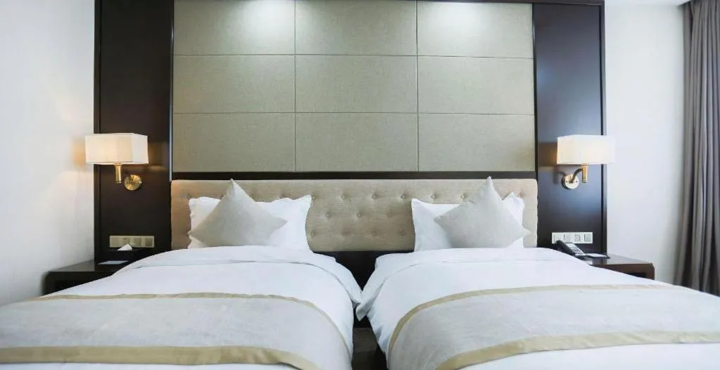 Bed in Hundred Hotel Qingdao