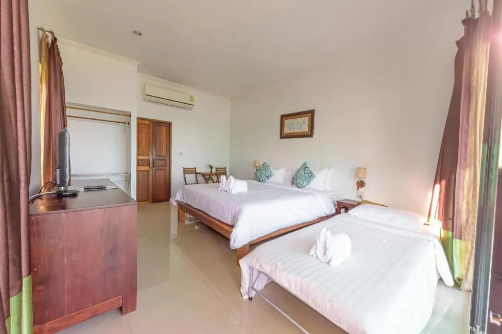 Bed in Villa Phra Chan Resort