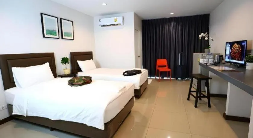 Bed in BAAN PAKNAM HOTEL