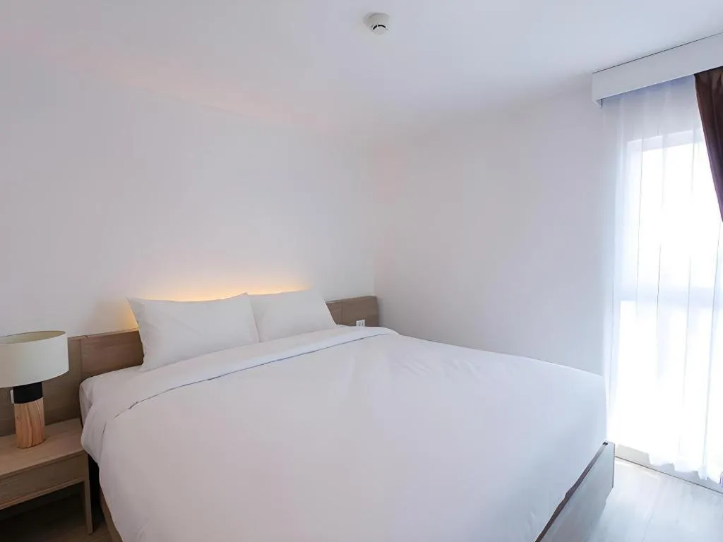 Bed in B2 Nakhonsawan Premier Hotel