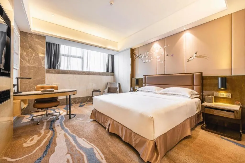 Bed in Licai Tianqi Hotel