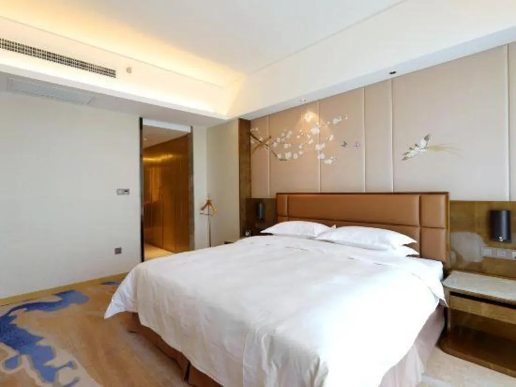 Bed in Licai Tianqi Hotel