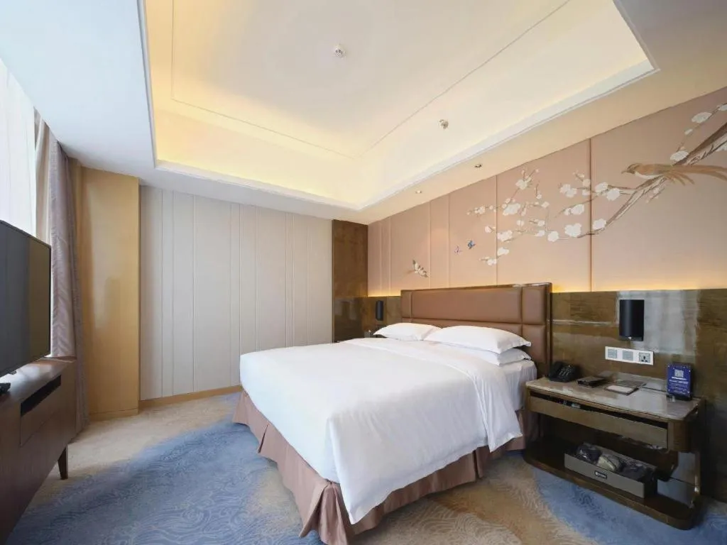 Bed in Licai Tianqi Hotel