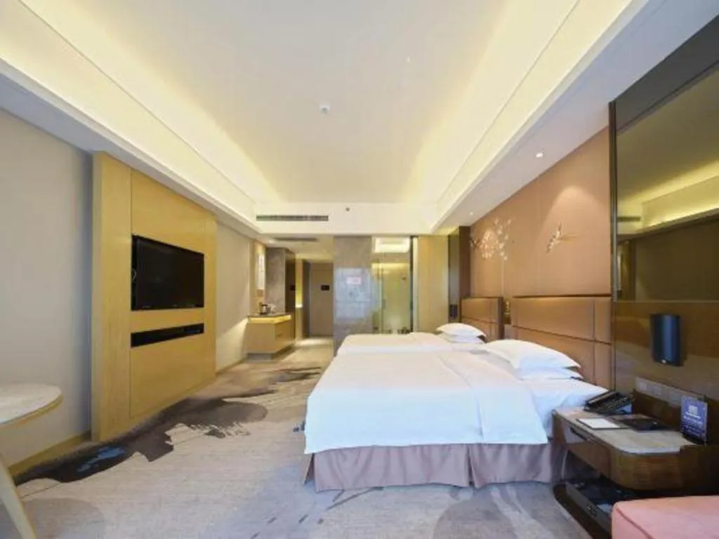 Bed in Licai Tianqi Hotel