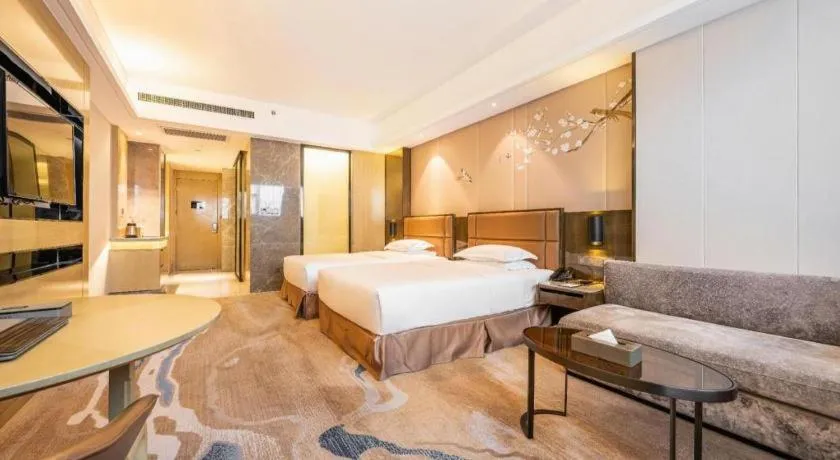 Bed in Licai Tianqi Hotel