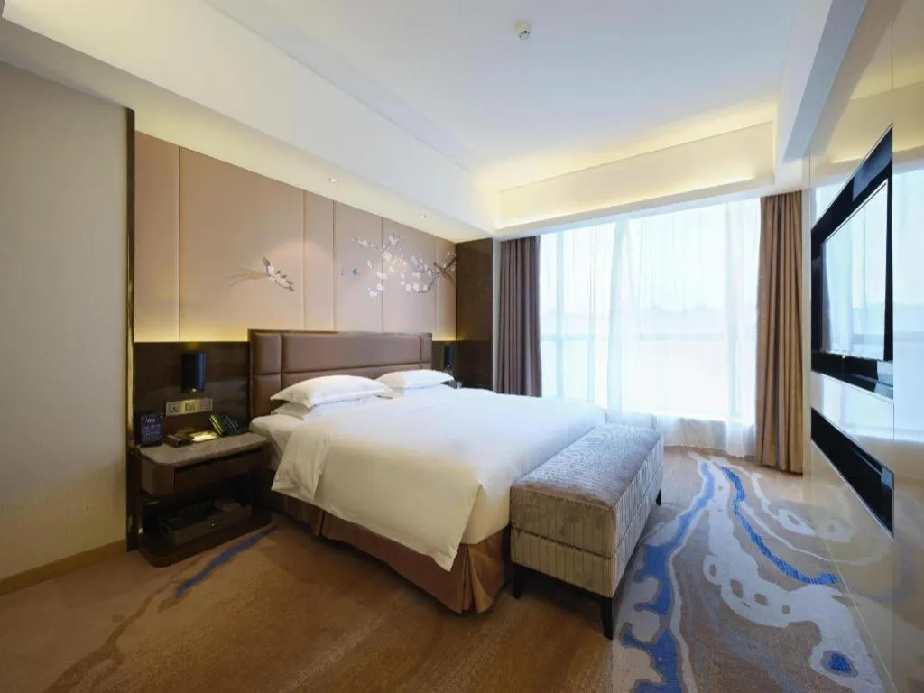 Bed in Licai Tianqi Hotel