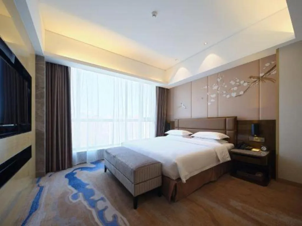 Bed in Licai Tianqi Hotel