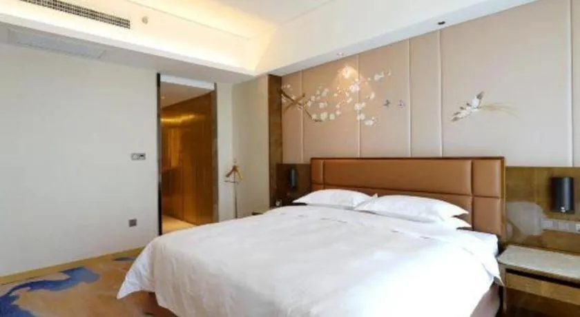 Bed in Licai Tianqi Hotel