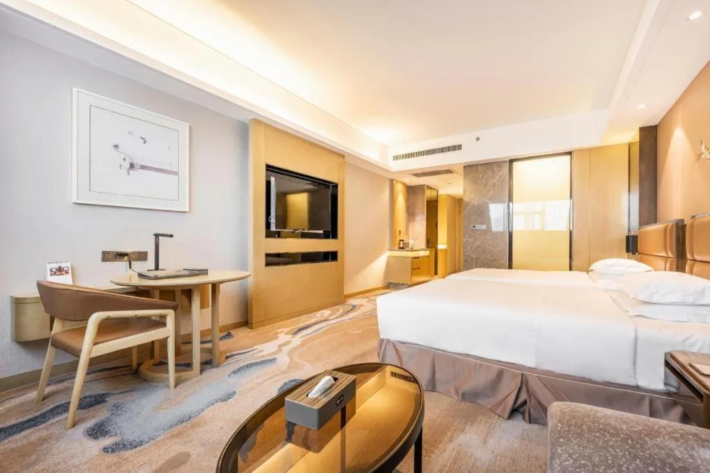 Bed in Licai Tianqi Hotel