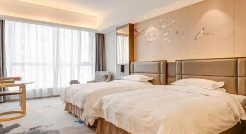 Bed in Licai Tianqi Hotel