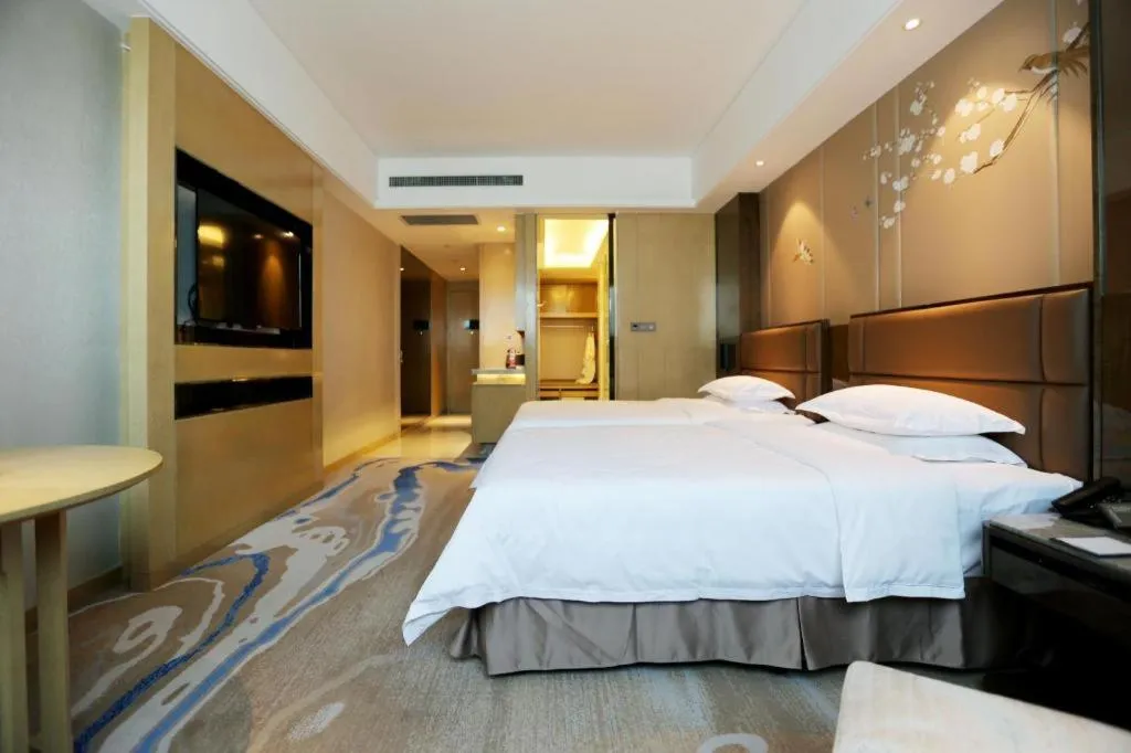 Bed in Licai Tianqi Hotel