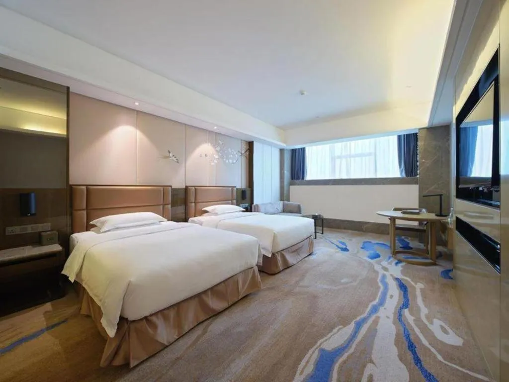 Bed in Licai Tianqi Hotel
